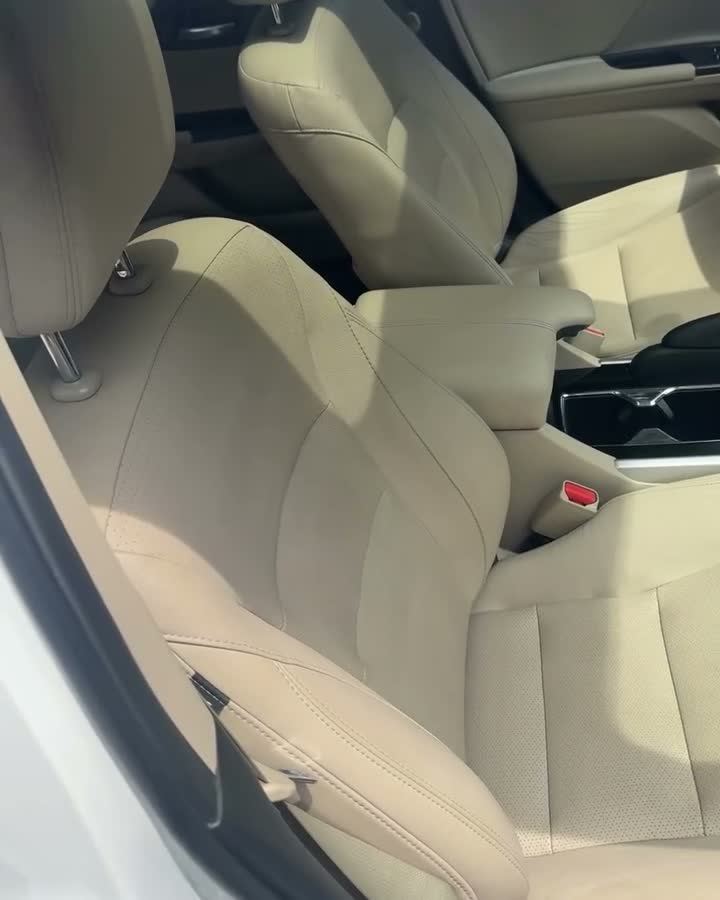 Tan leather front seats and console after an interior reset